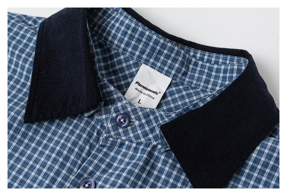 Close-up of a blue checked shirt showing its dark collar, buttons, and sewn-in label.