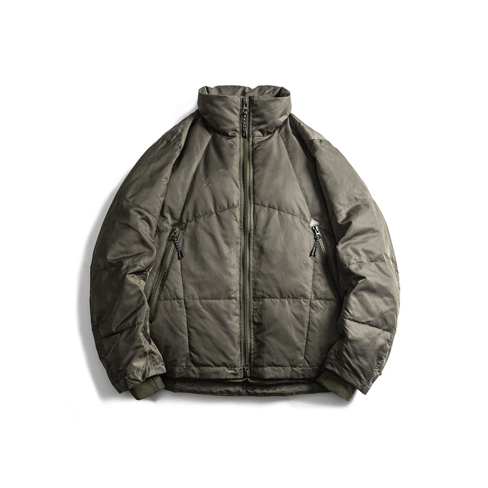 Green quilted stand-collar zip jacket with diagonal zippered pockets and ribbed cuffs, front flat lay