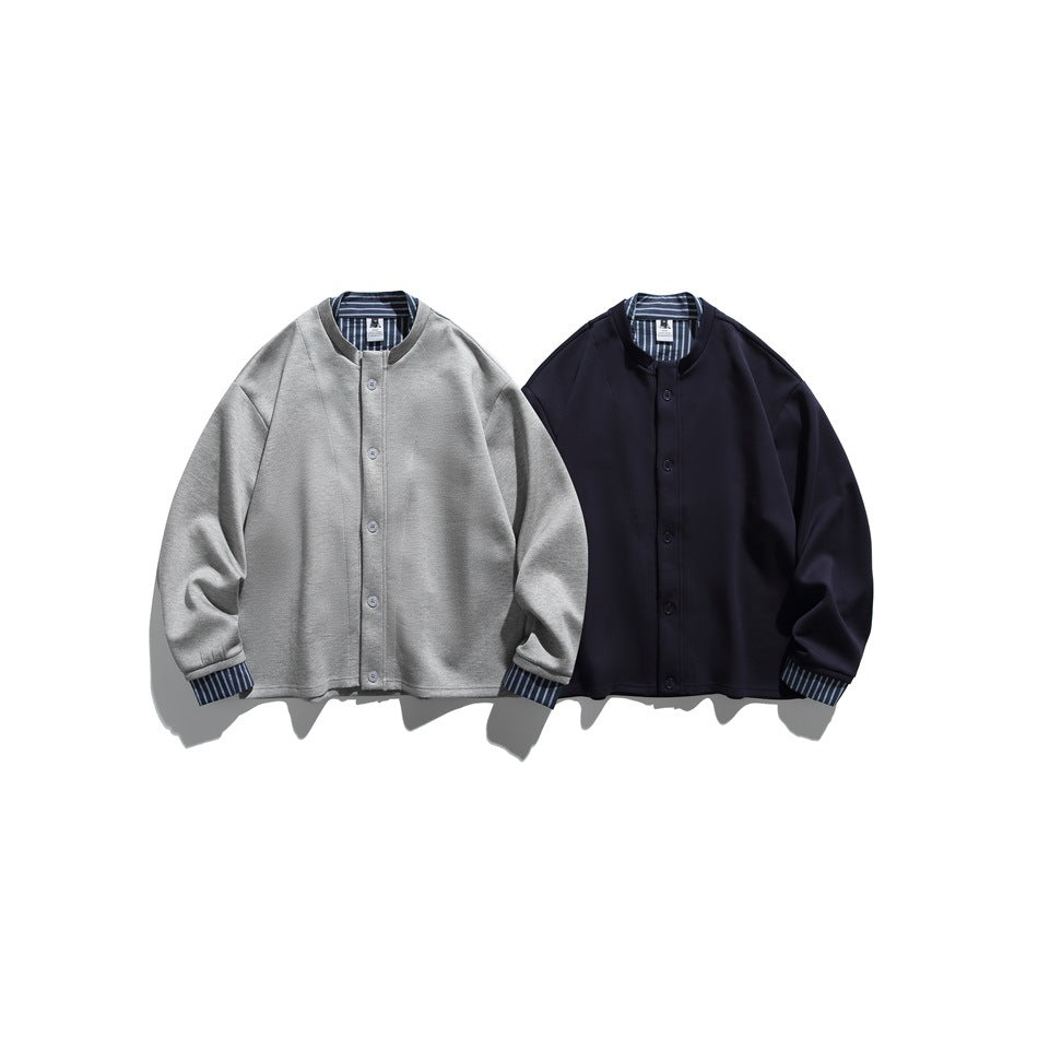 Two button-front jackets shown side by side in light gray and dark navy, with striped collar and cuff details.