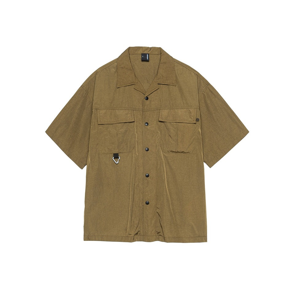 Dark khaki short-sleeve camp collar shirt with snap buttons and two chest flap pockets, flat front view