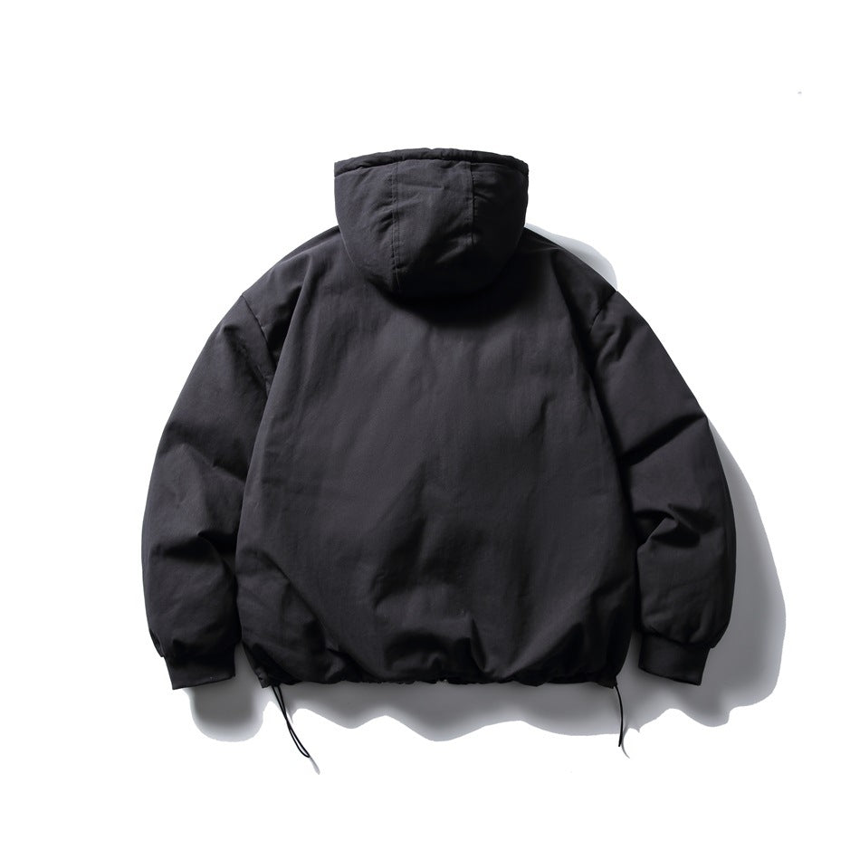 Back view of a black hooded jacket with long sleeves and an adjustable hem.