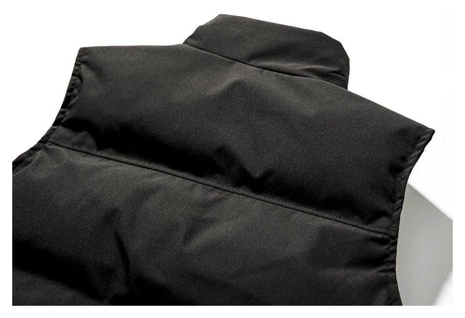 Close-up of the black garment's raised collar and back neckline.