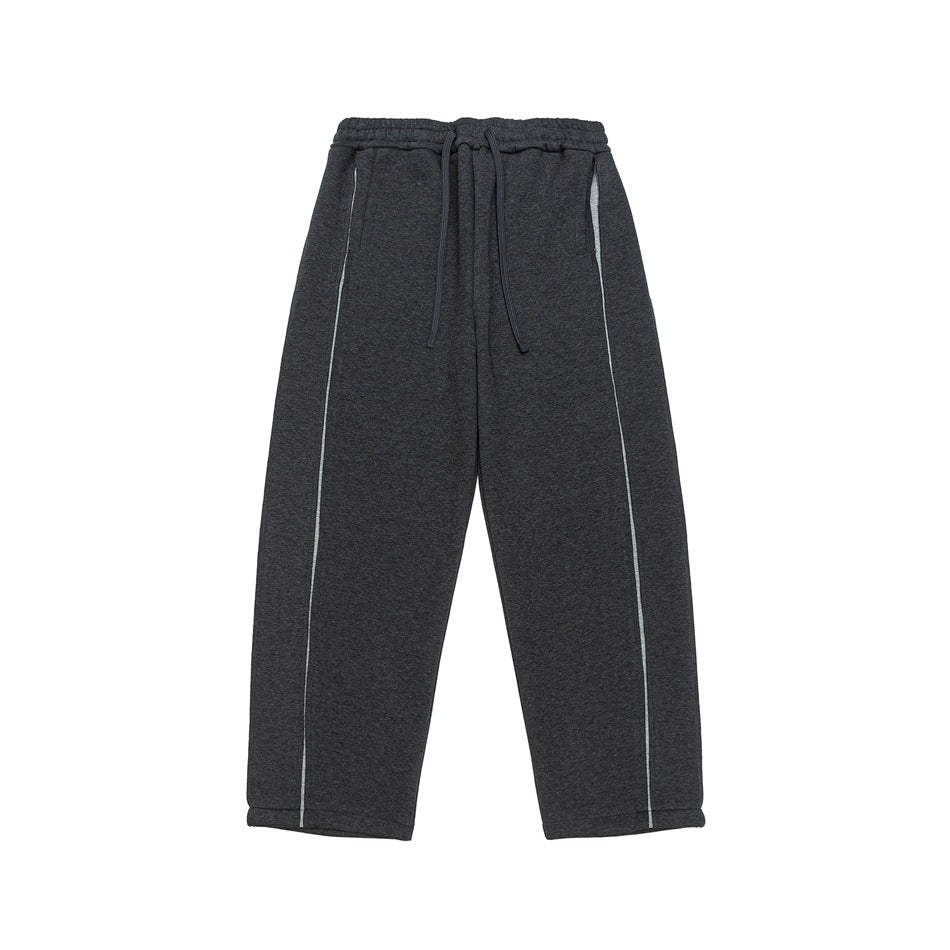 Dark gray heathered wide-leg sweatpants with drawstring waist and light piping seams, flat lay front view