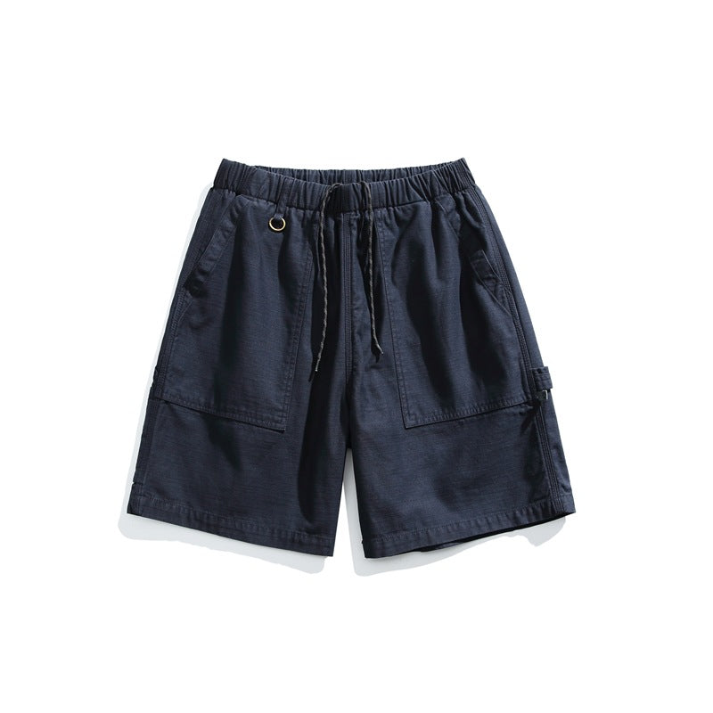 Navy men's drawstring shorts with large front patch pockets, front view on white background