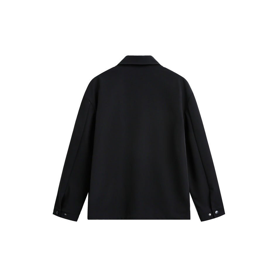 Back view of a black jacket with a folded collar and long sleeves with snap-tab cuffs.