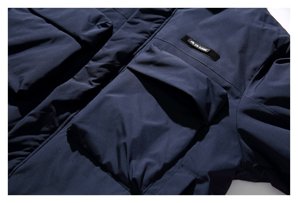 Close-up of the jacket's large front pocket and small sewn label.
