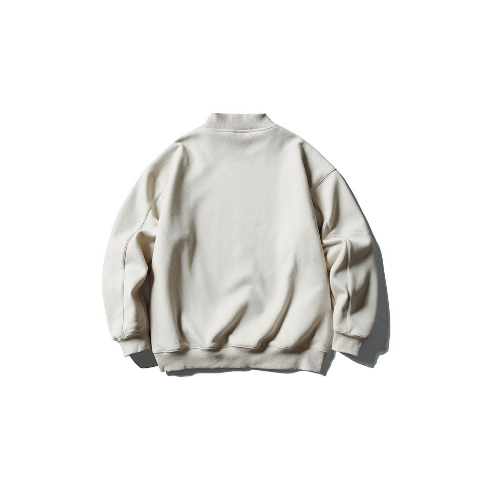Back view of an off-white mock-neck sweatshirt with long sleeves and ribbed cuffs and hem.