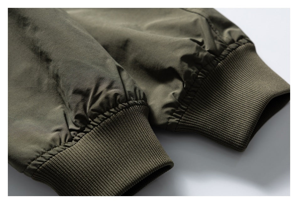 Close-up of the olive green jacket's gathered sleeve ends and wide ribbed cuffs.