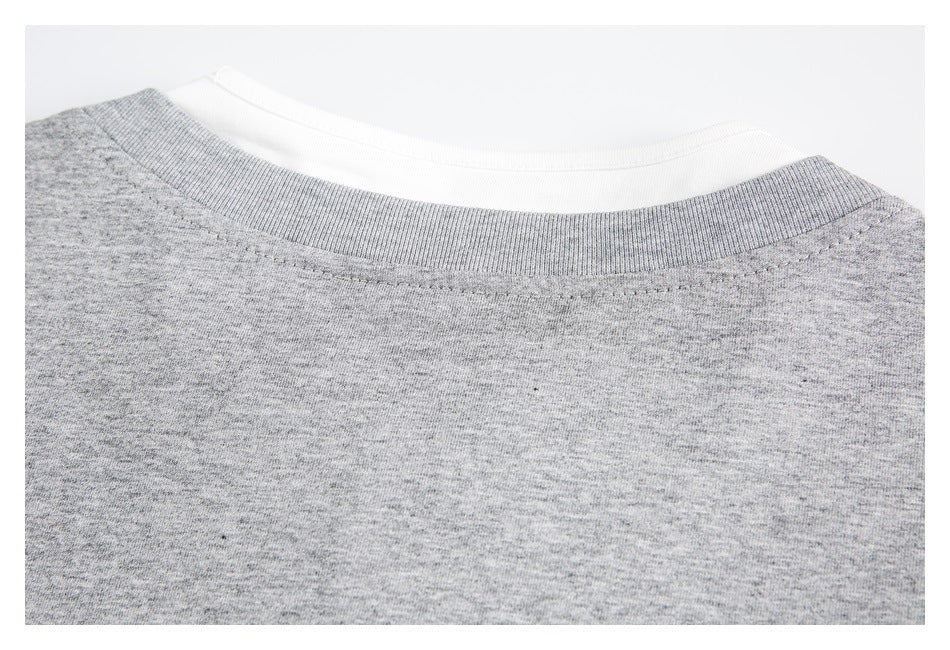 Close-up of the heather gray shirt's ribbed back neckline and shoulder stitching.