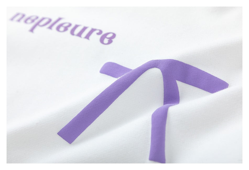 Angled close-up of the purple bow graphic and lettering printed on the white hoodie.