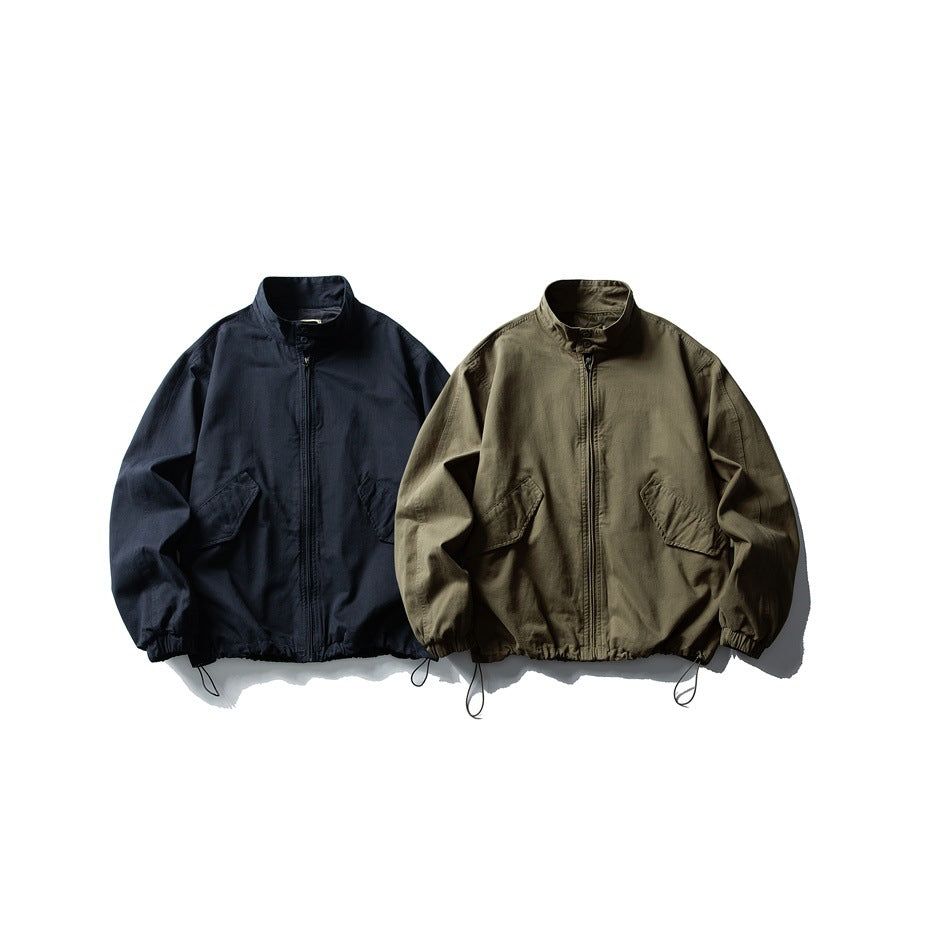 Two zip-front jackets with stand collars and flap pockets, shown in navy and olive.