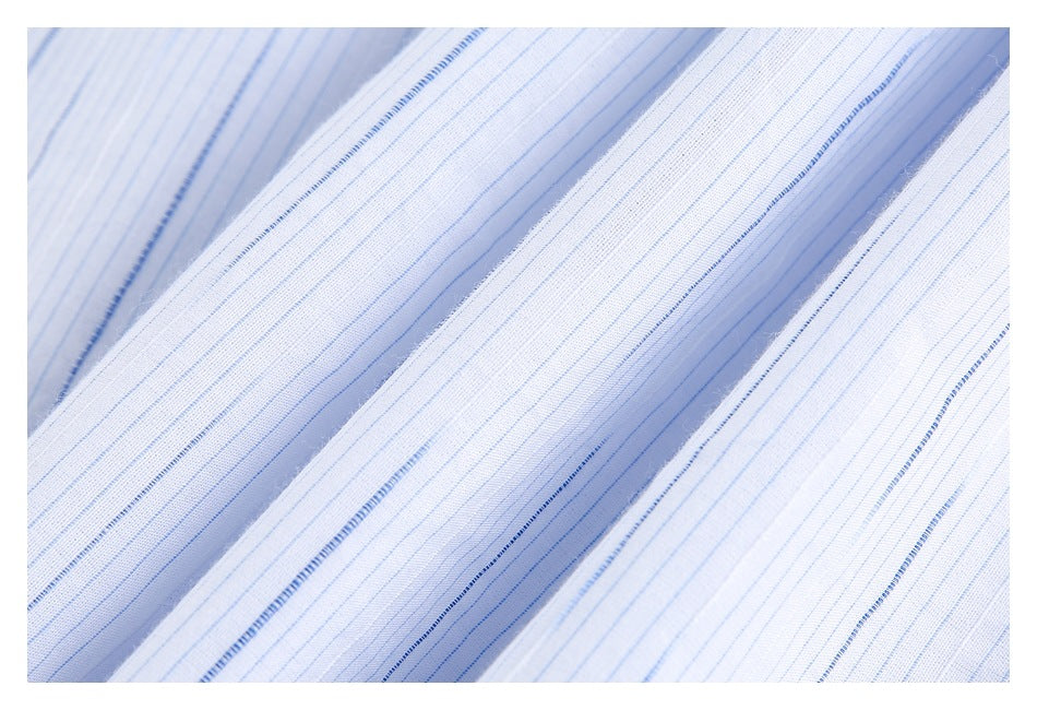 Extreme close-up of white shirt fabric with fine blue stripes and a woven texture.