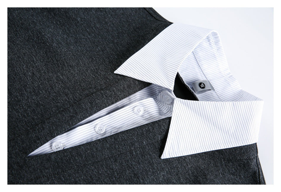 Close-up of a charcoal heather shirt with a white, fine-striped collar and buttoned placket.