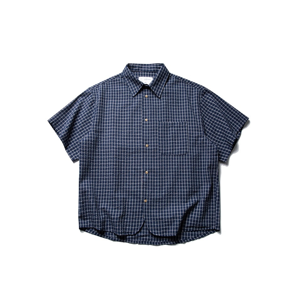 Navy blue check short-sleeve button-up shirt with chest pocket and curved hem, flat lay front view