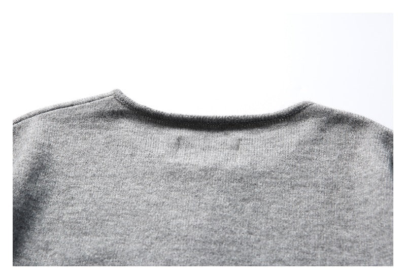 Partial back view of a heather gray knit sweater, showing the neckline and shoulders.