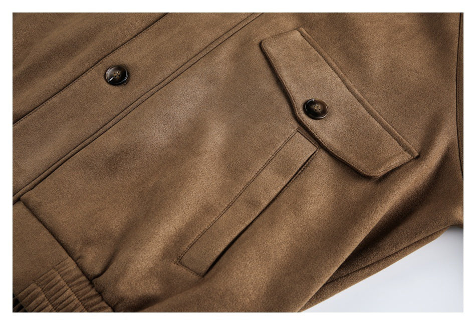 Close-up of a brown jacket showing a buttoned flap pocket, a narrow pocket opening, and an elasticated edge.
