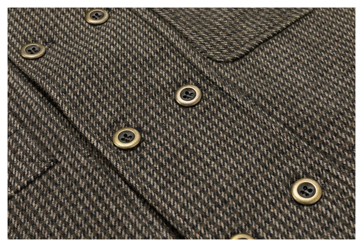 Close-up of a brown and charcoal herringbone jacket front with antique-gold buttons and a notched lapel.
