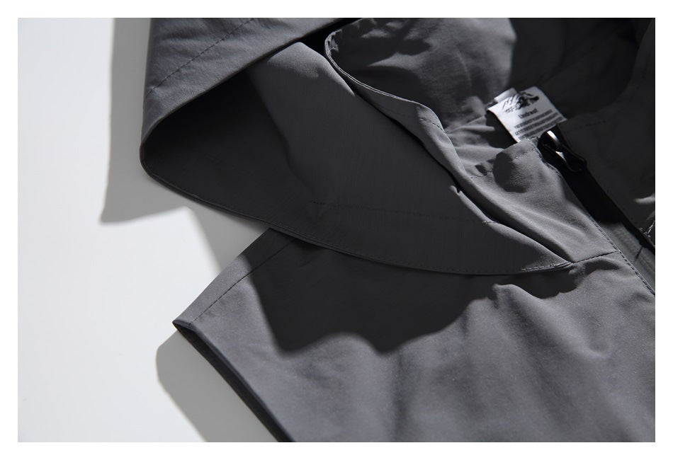 Close-up of the charcoal vest's hood lining and inner collar on a white background.
