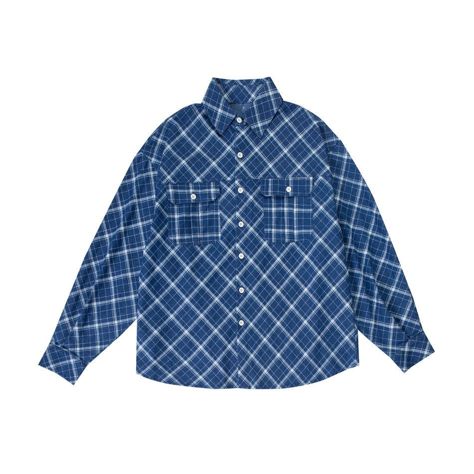 Blue diagonal plaid long-sleeve button-up shirt with two flap chest pockets, flat lay front view