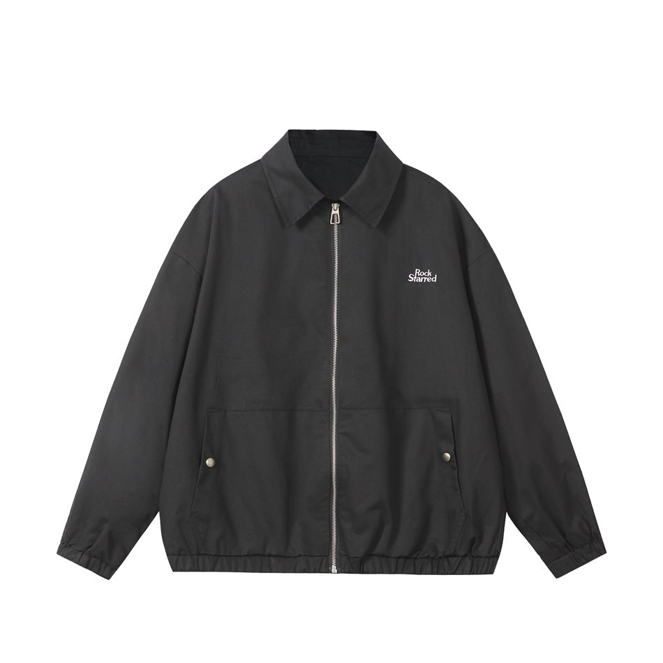 Black zip-front collared jacket flat lay with silver zipper, snap-button pockets and elastic hem