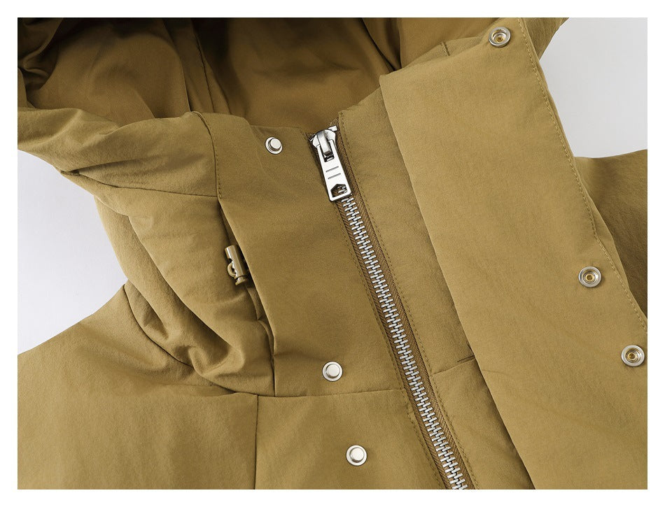 Close-up of the tan jacket's front zipper and snap-fastened storm flap.