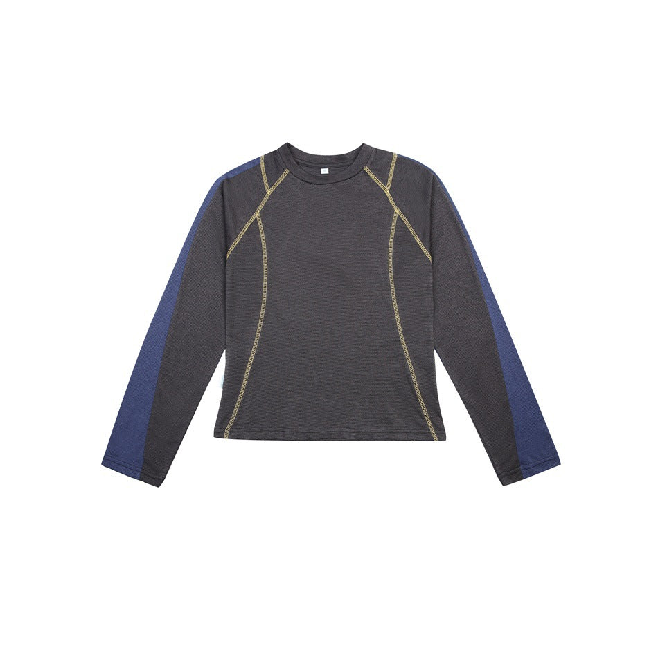 Charcoal long-sleeve top with blue sleeve panels and yellow topstitching, flat front view