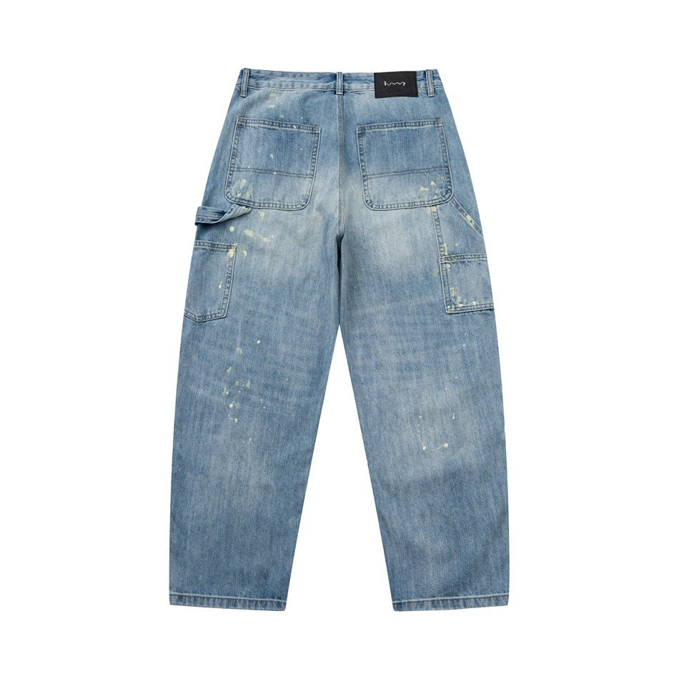 Back of light blue washed jeans with patch pockets, black waistband label and carpenter side pocket