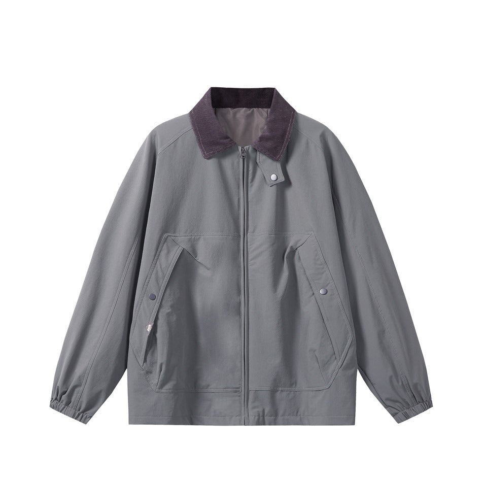 Blue-gray zip-front jacket with muted purple ribbed collar, snap pockets and elastic cuffs, flat front view