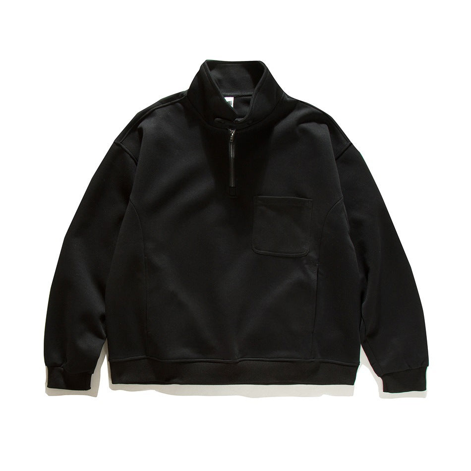 Black half-zip stand-collar sweatshirt flat lay with chest patch pocket and ribbed cuffs and hem