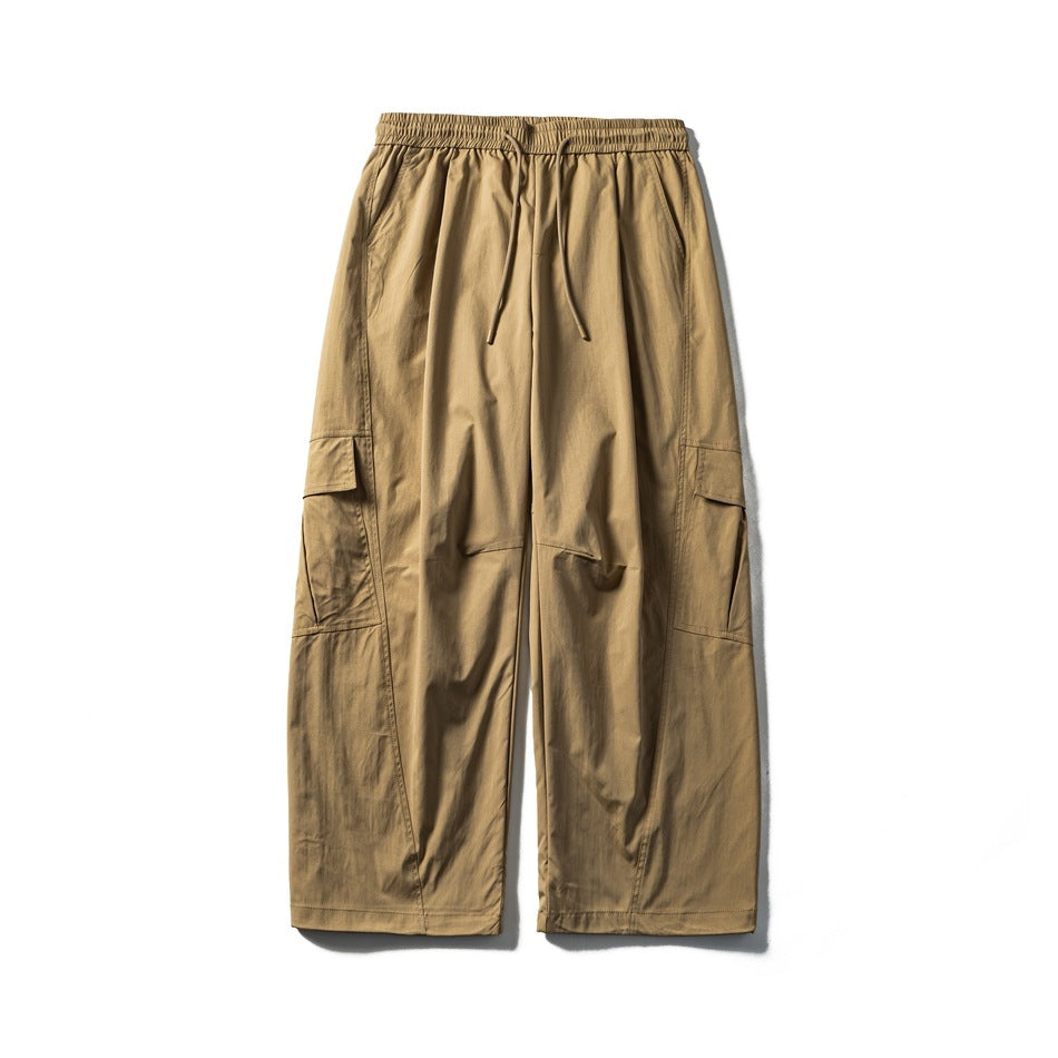 Khaki wide-leg cargo pants with drawstring elastic waist and side flap cargo pockets, flat lay front view