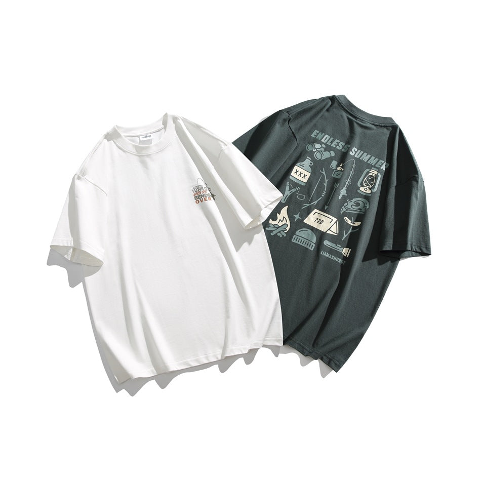 White and dark green oversized graphic T-shirts displayed together, showing their fronts.