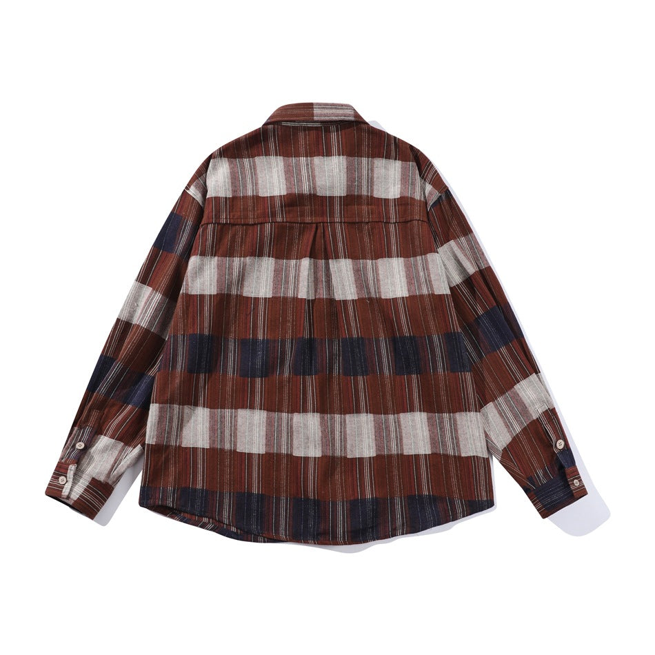 Back view of a long-sleeve plaid shirt in rust brown, cream, and navy, laid flat on white.