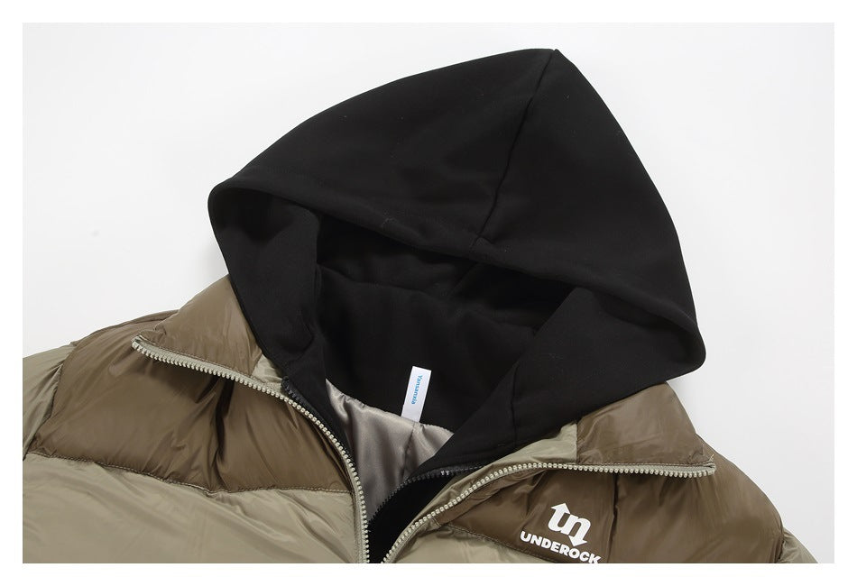 Close-up of a two-tone taupe puffer jacket with a black hood, front zipper, and white UNDEROCK chest logo.