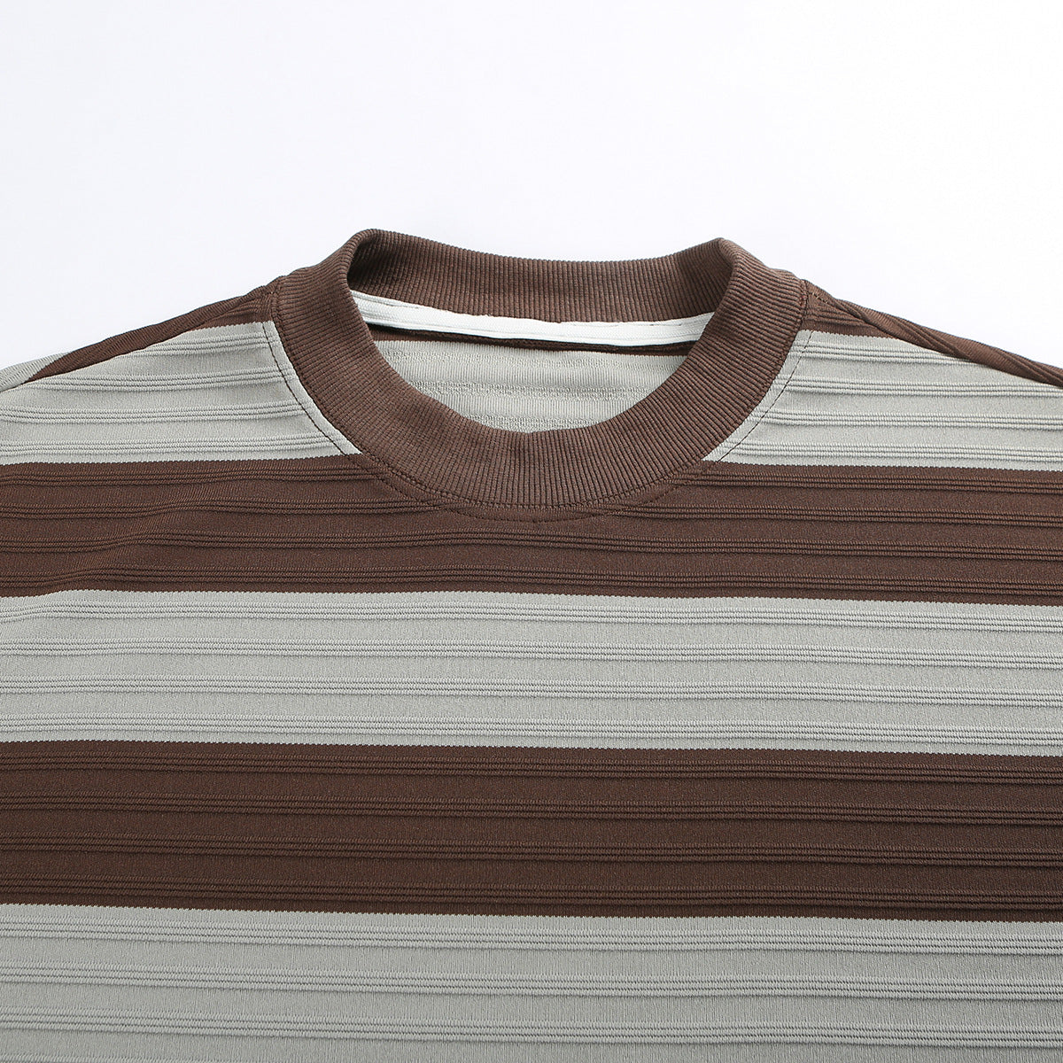 Close-up of a brown and gray striped T-shirt showing its ribbed crew neck and shoulder.
