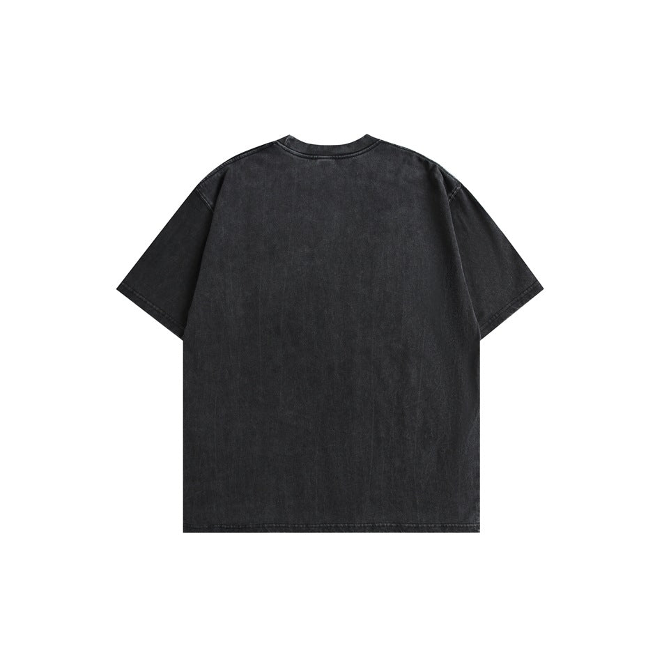 Back of washed black short-sleeve crew-neck t-shirt, plain with no print, flat lay