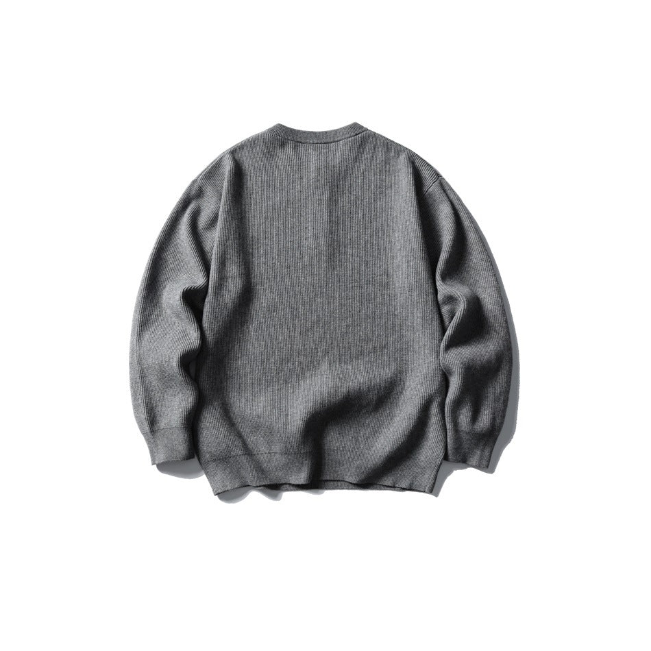 Back view of a plain gray long-sleeve rib-knit sweater.