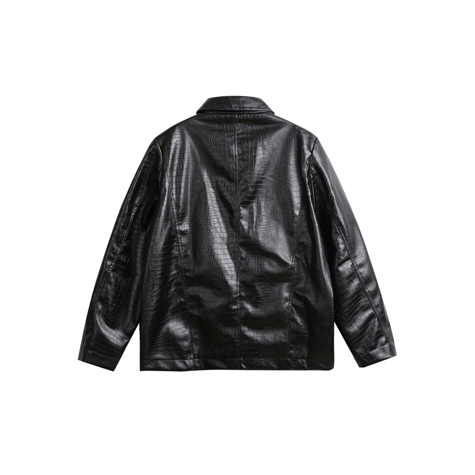 Back view of a black, crocodile-textured jacket with a notched collar and long sleeves, laid flat on white.