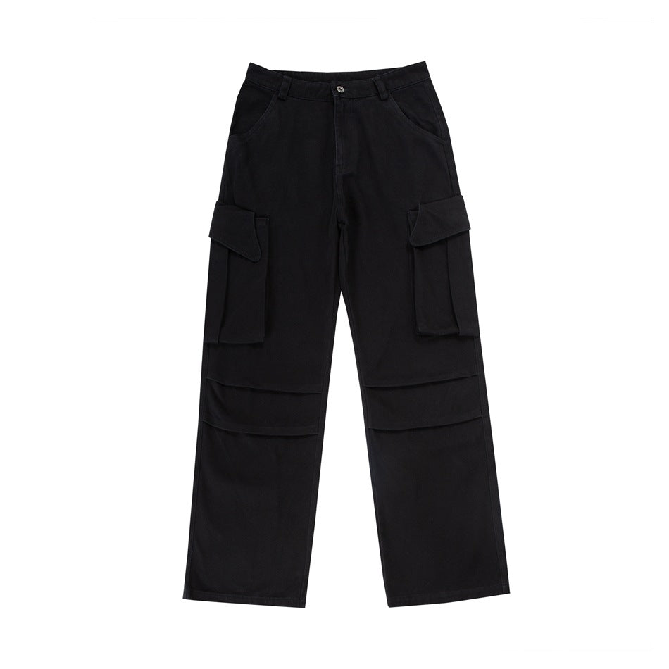 Black wide-leg cargo pants flat lay with large flap thigh pockets and knee pleats