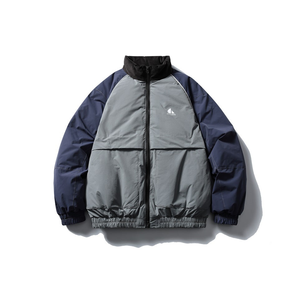 Gray and navy color-block stand-collar zip jacket with black collar, front pockets and elastic cuffs, flat front view