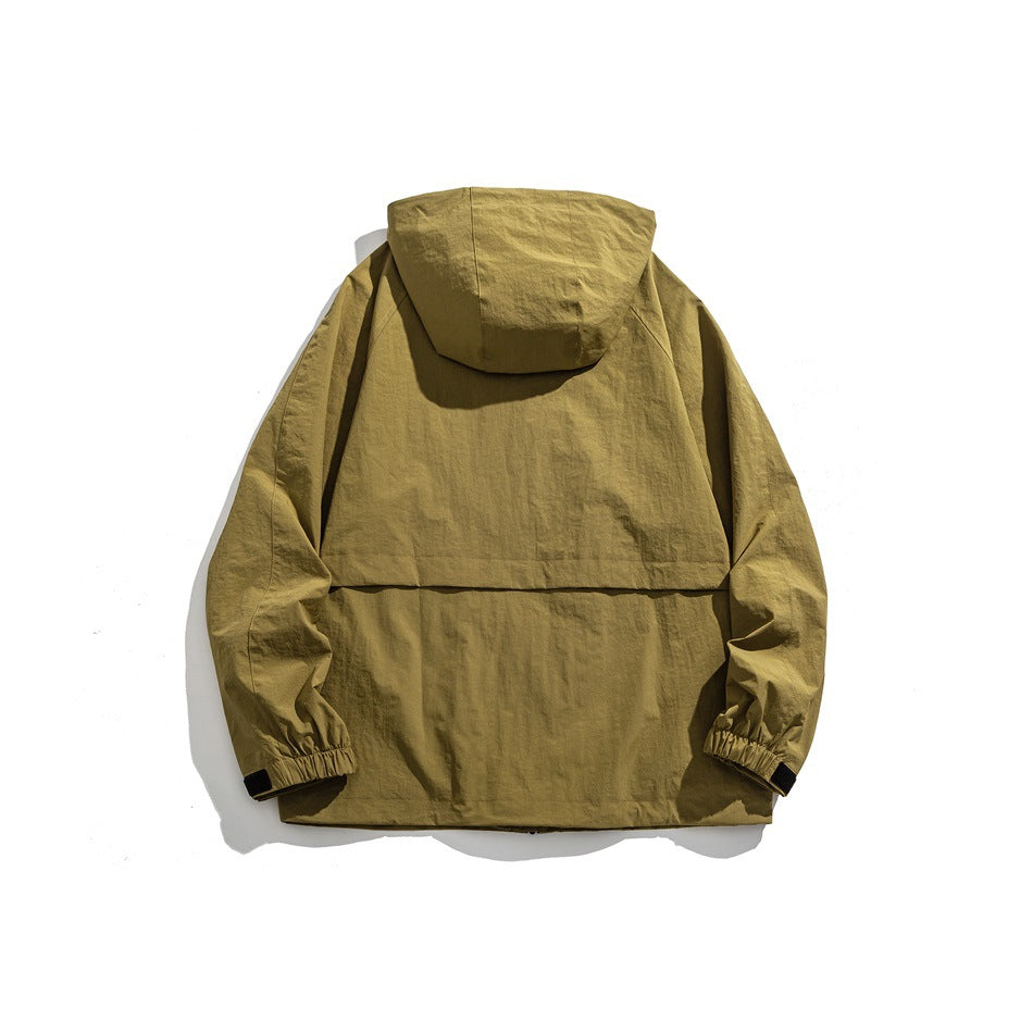 Back view of khaki yellow hooded jacket showing hood, horizontal back seam and elastic cuffs