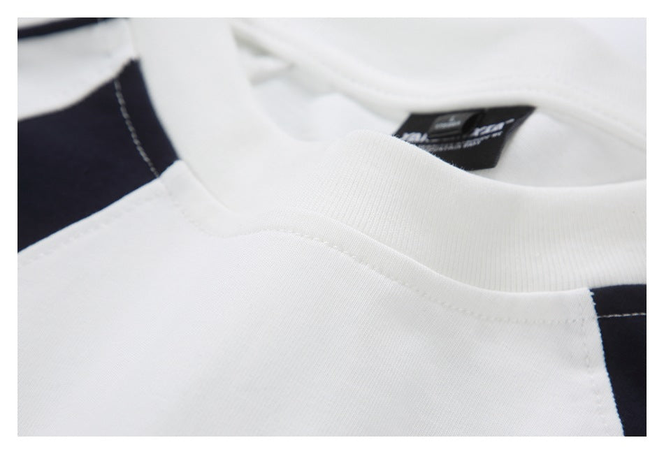 Close-up of the white ribbed crew neck, shoulder seam, and black contrast panel.