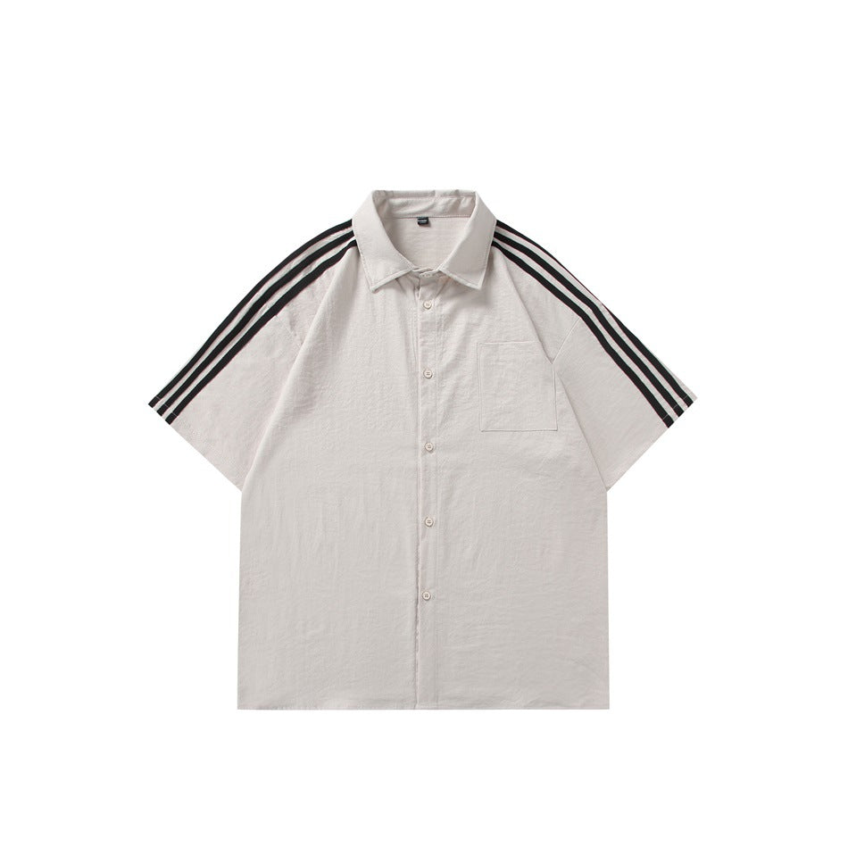 Front view of an off-white short-sleeve button-up shirt with a chest pocket and three black shoulder stripes.