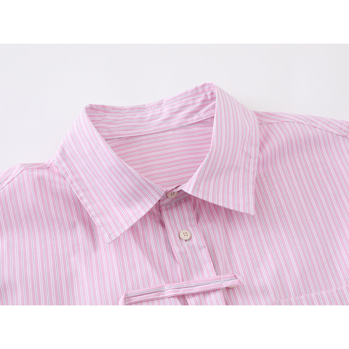 Close-up of a pink-and-white striped shirt collar, top buttons, and front placket.