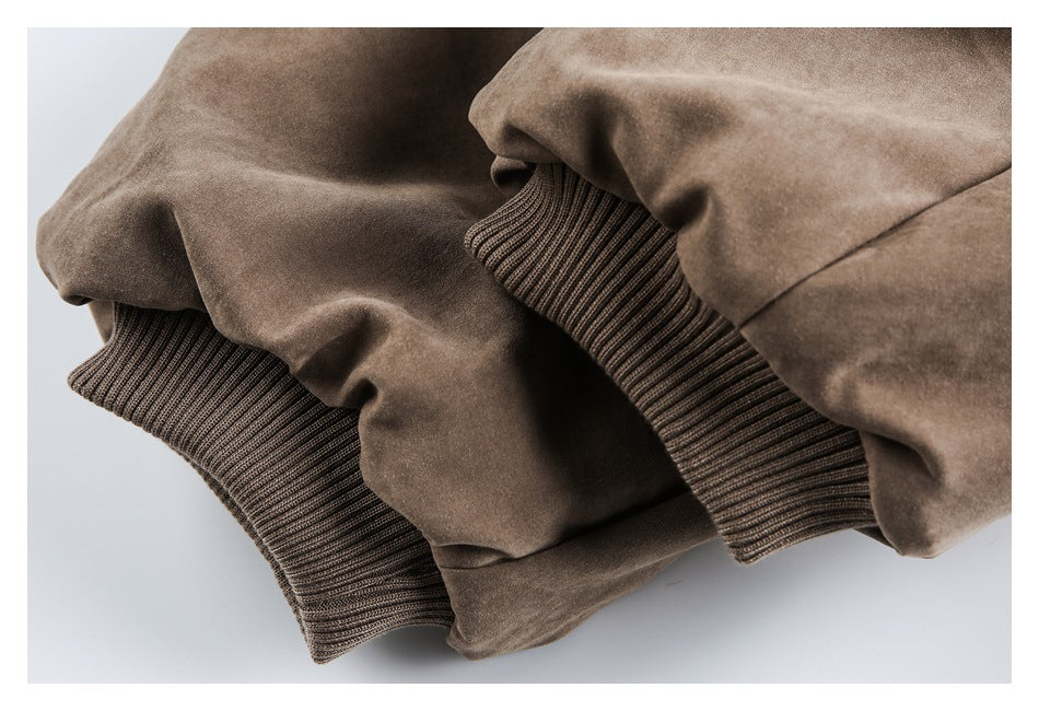 Close-up of ribbed brown knit cuffs on a brown jacket.