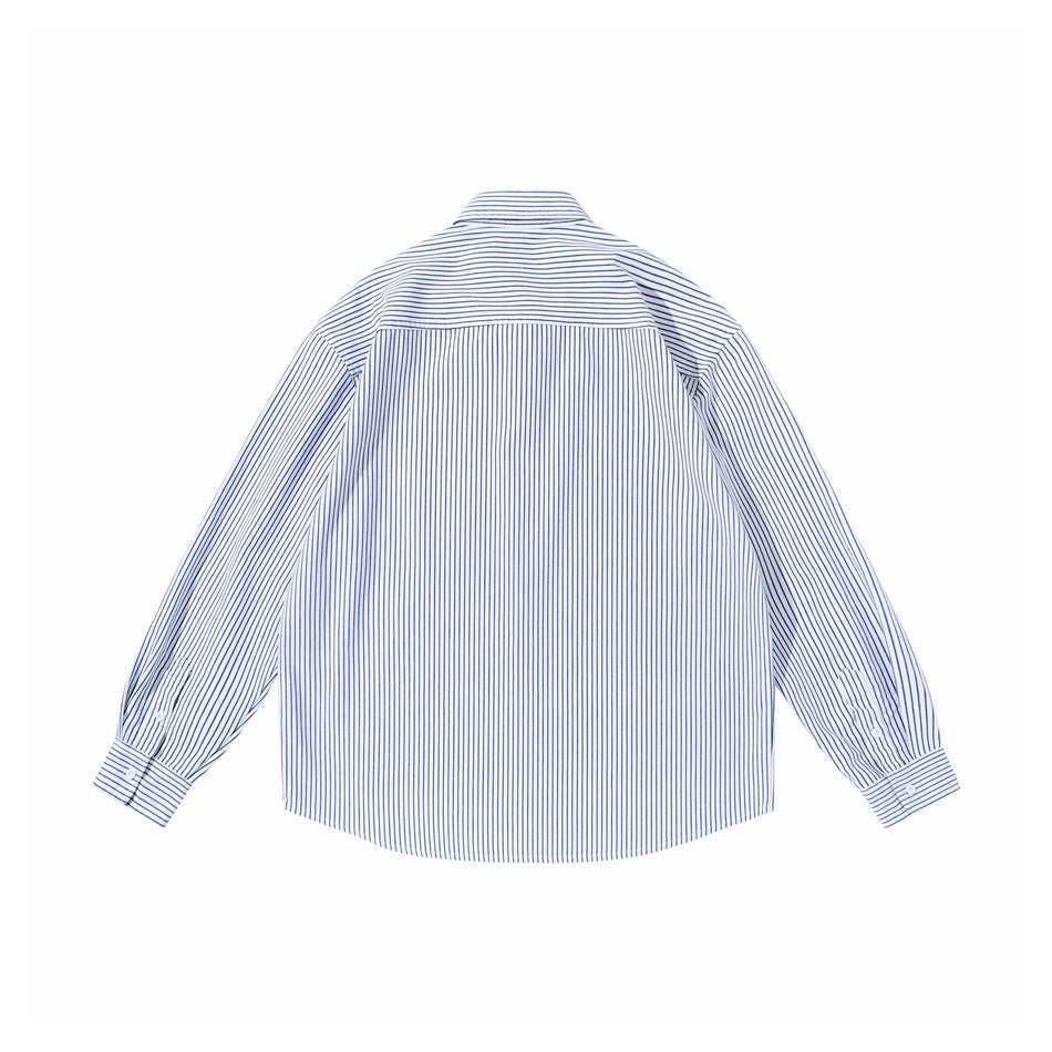 Back view of blue and white striped long-sleeve shirt with horizontal-striped yoke and buttoned cuffs, flat lay