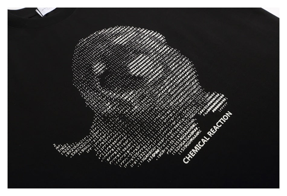 Close-up of a black T-shirt with a white text-based graphic and lettering across the chest.