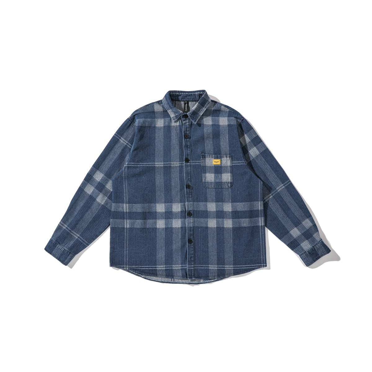 Washed blue plaid denim-look long-sleeve button shirt laid flat, with chest pocket and small yellow label