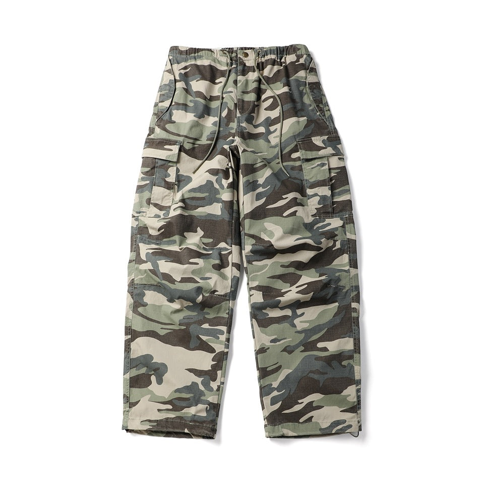 Green, beige and gray camouflage cargo pants, front flat lay, with drawstring waist and flap thigh pockets
