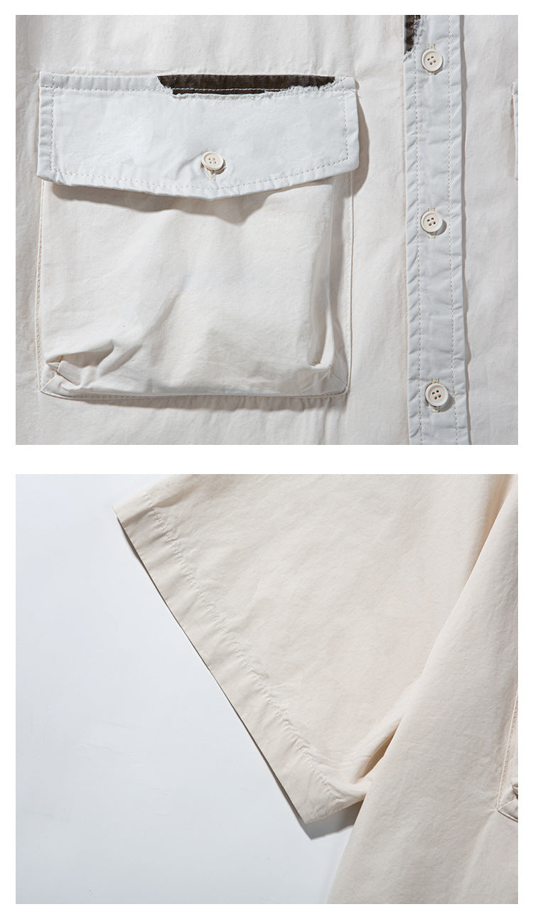 Close-up of an off-white shirt showing its buttoned chest pocket and short sleeve.
