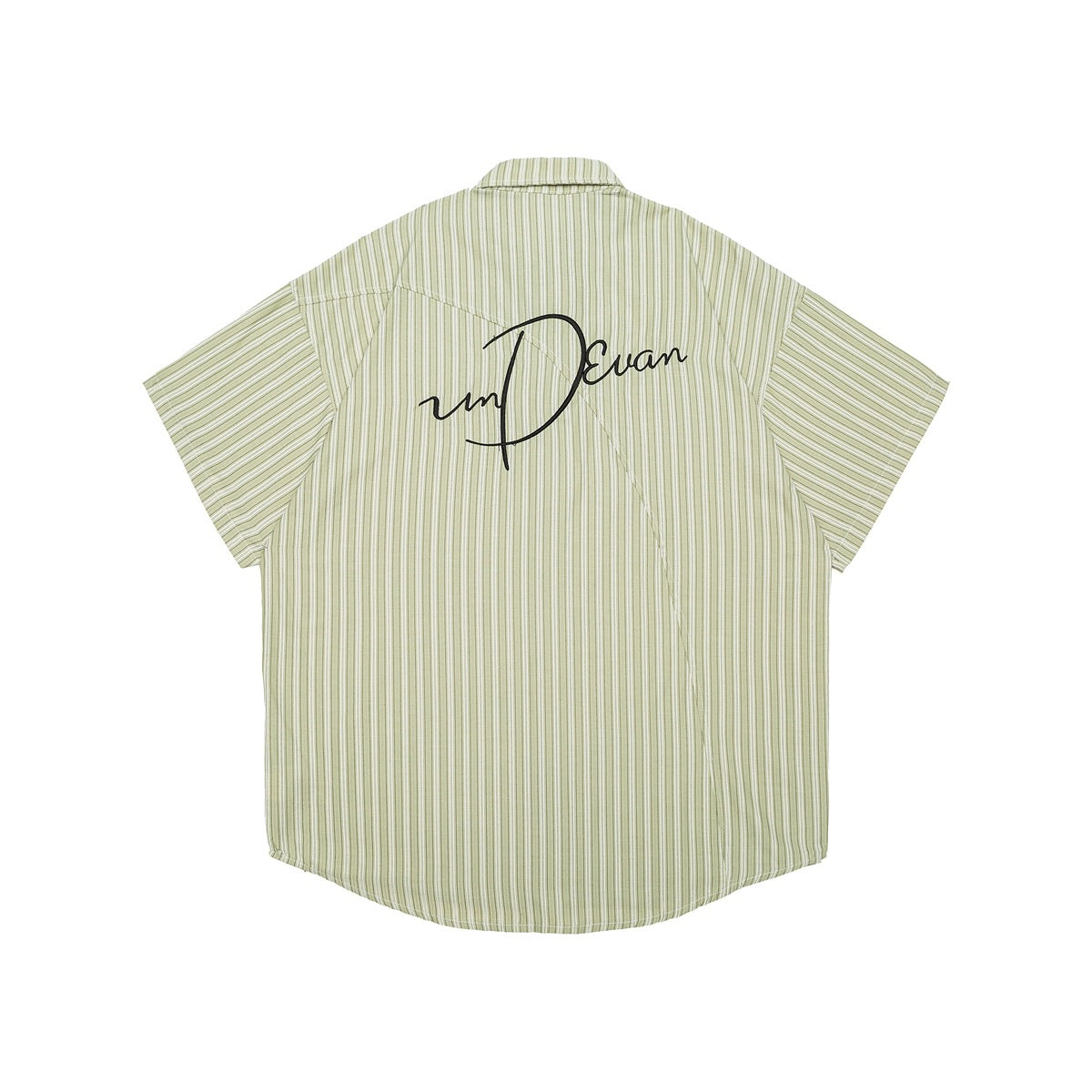 Back of a pale green short-sleeve striped button-up shirt with black cursive embroidery across the upper back.